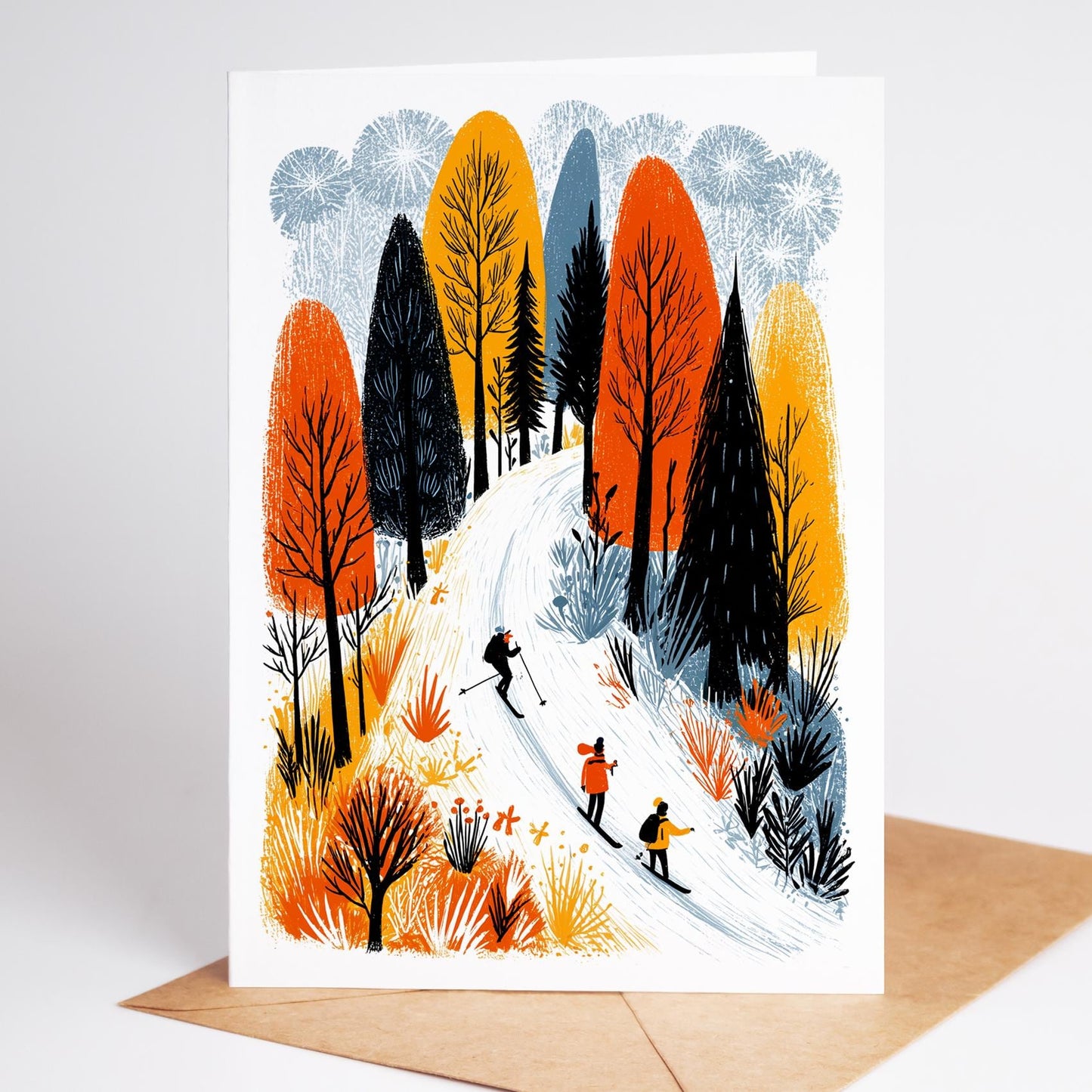 Greeting card with illustration of skiers in a forest during autumn.