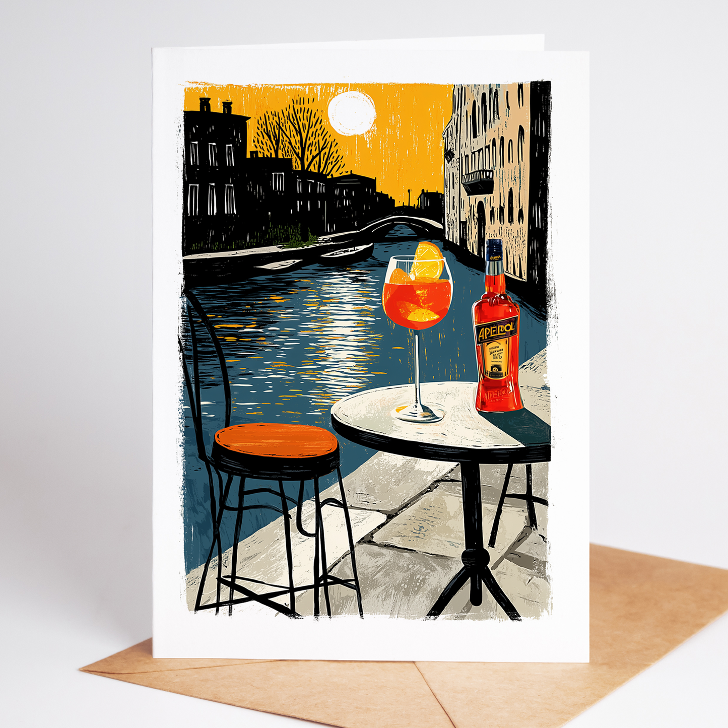 Greeting card with a Venice canal scene, table with a drink and bottle, and a yellow envelope.