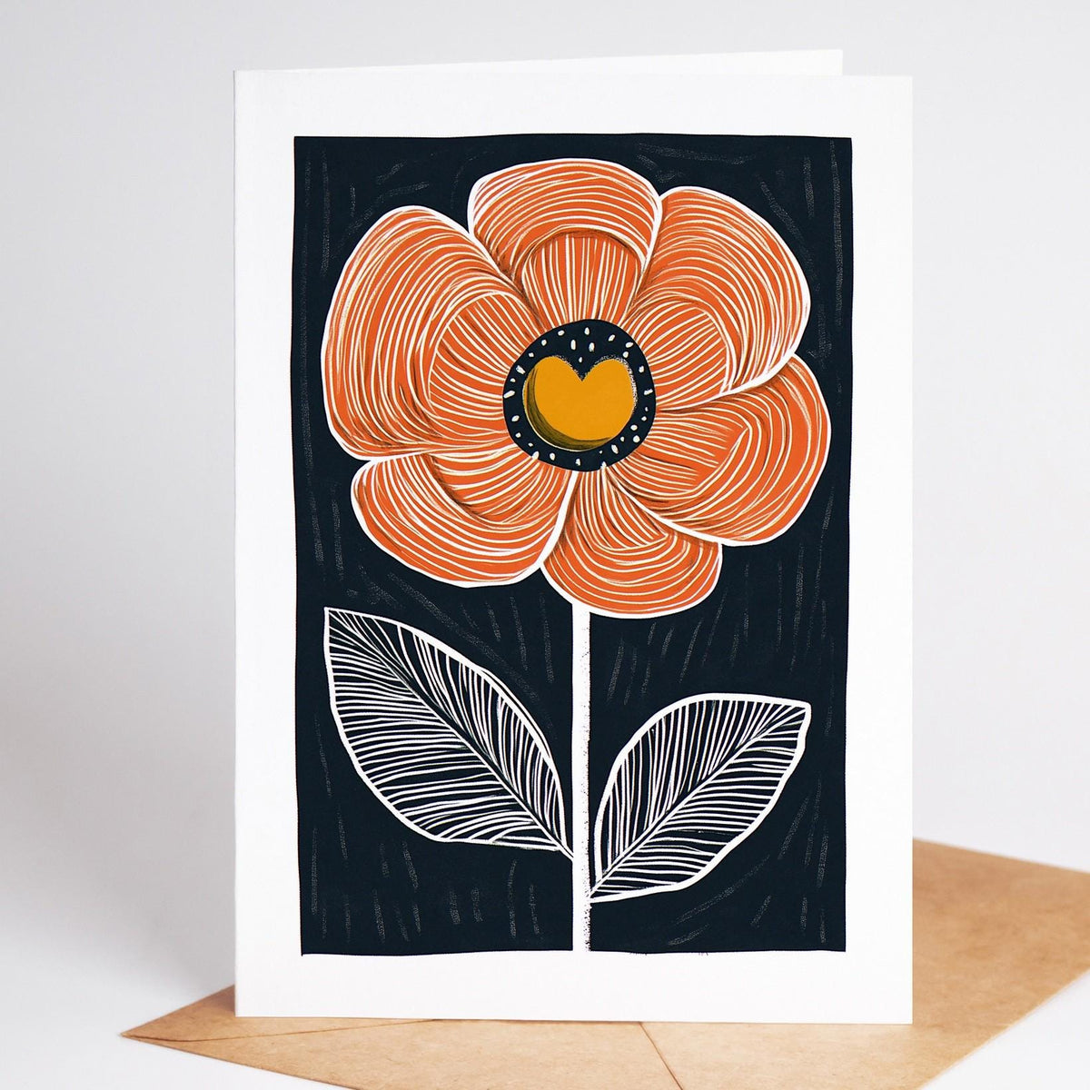 Mid century modern floral card, a coral bloom with white-lined leaves on navy
