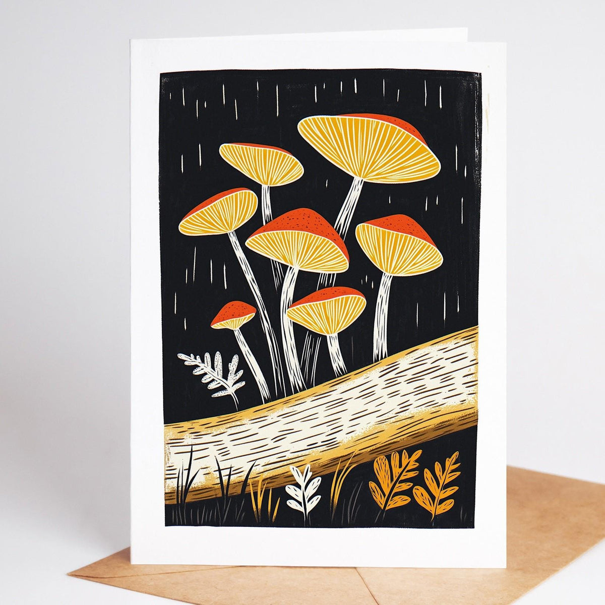 Mushroom card, yellow and orange mushrooms growing from a fallen birch log