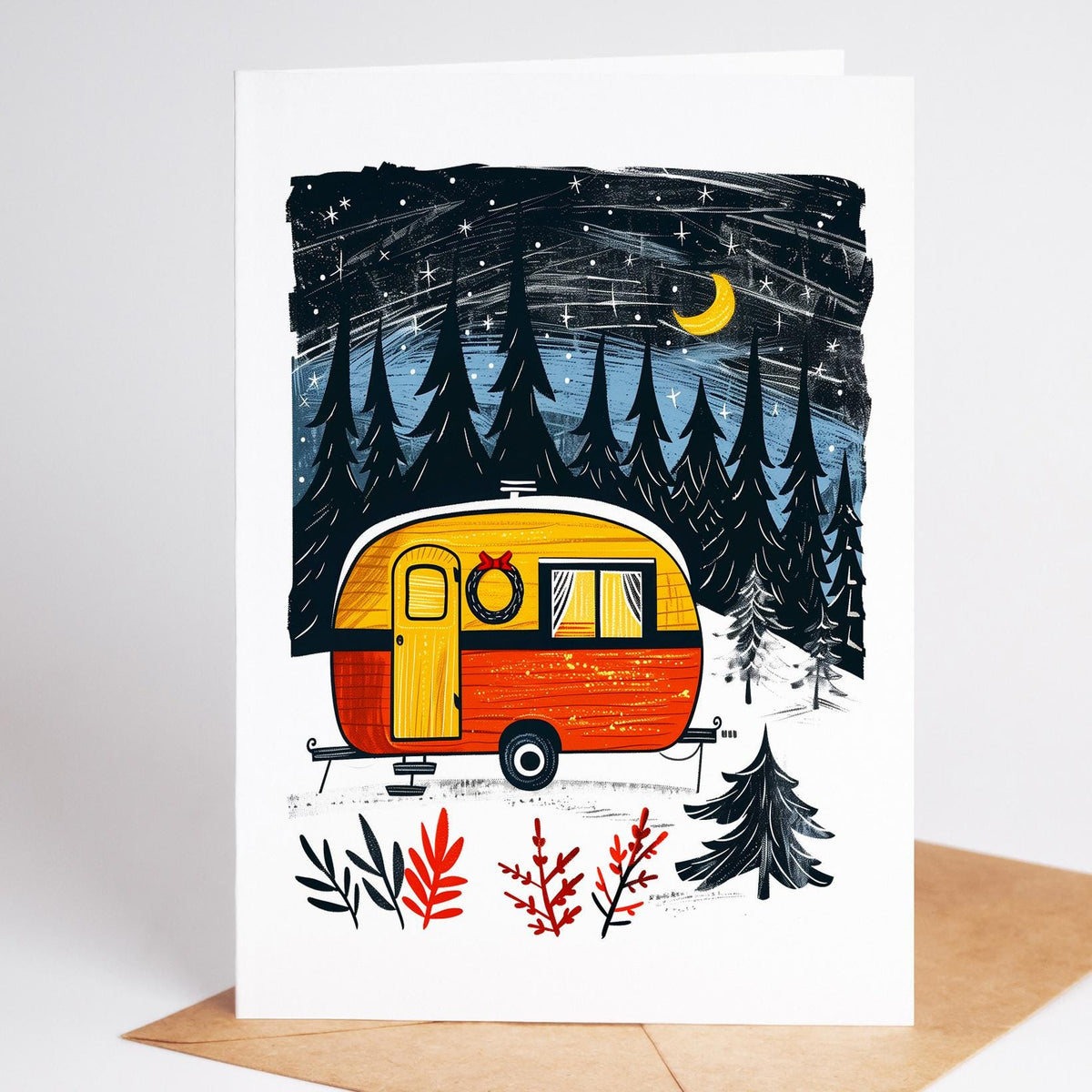Camping Christmas card of a vintage orange camper with a wreath in the snow