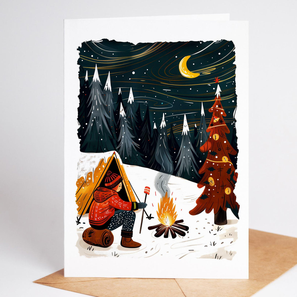 Camping Christmas card of a camper toasting marshmallows beside a decorated tree