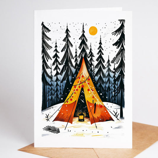 Camping Christmas card of an orange tent hung with ornaments among snowy pines