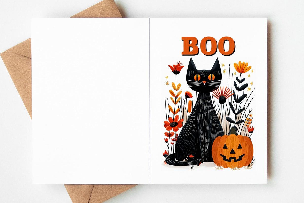 Single Boo black cat Halloween card standing upright with its envelope on a plain background