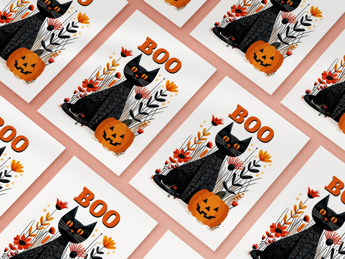 Boo Halloween cards laid out in a diagonal grid on a pink background, black cat and pumpkin design