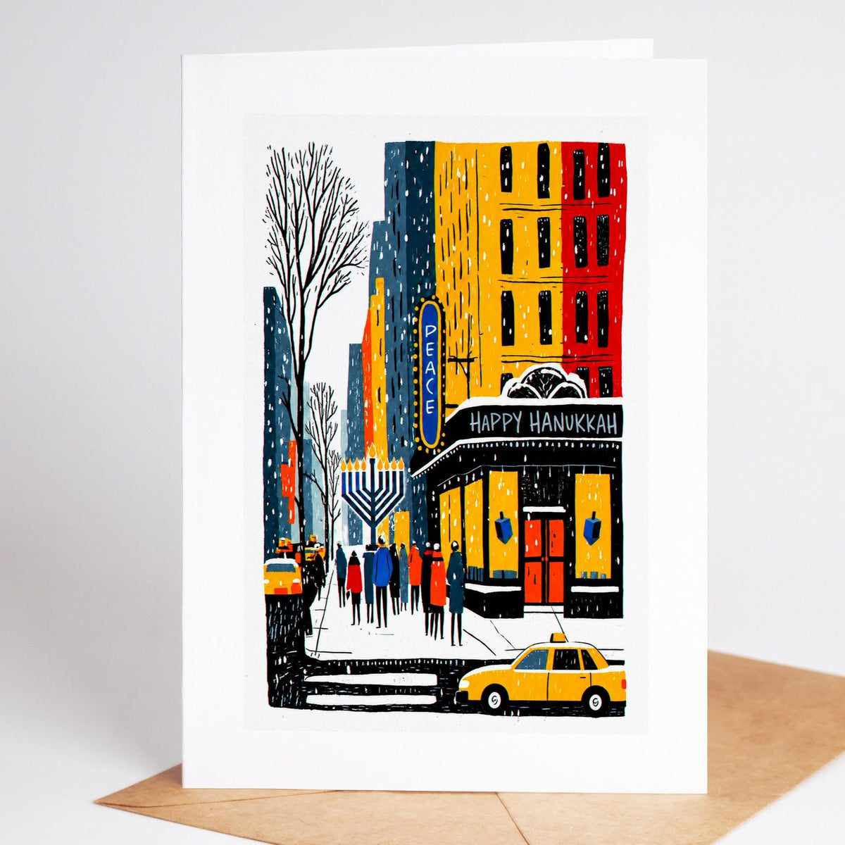 New York Hanukkah card standing upright, a street corner with Peace and Happy Hanukkah signs above a yellow taxi