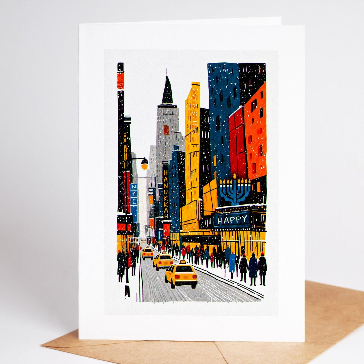 New York Hanukkah card standing upright, a midtown street canyon in the snow with a lit menorah on a marquee