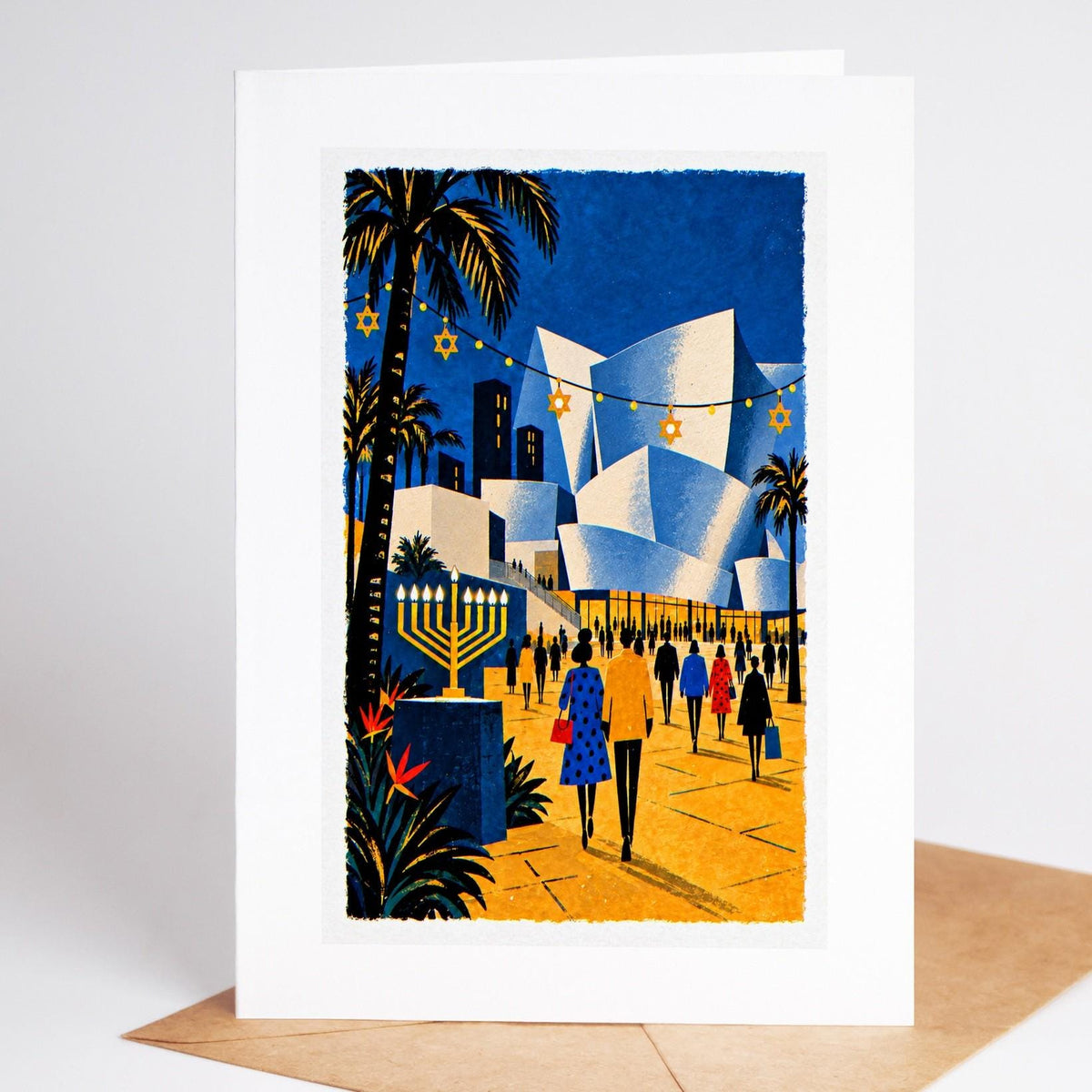 Los Angeles Hanukkah card standing with envelope, Walt Disney Concert Hall under string lights with a lit menorah