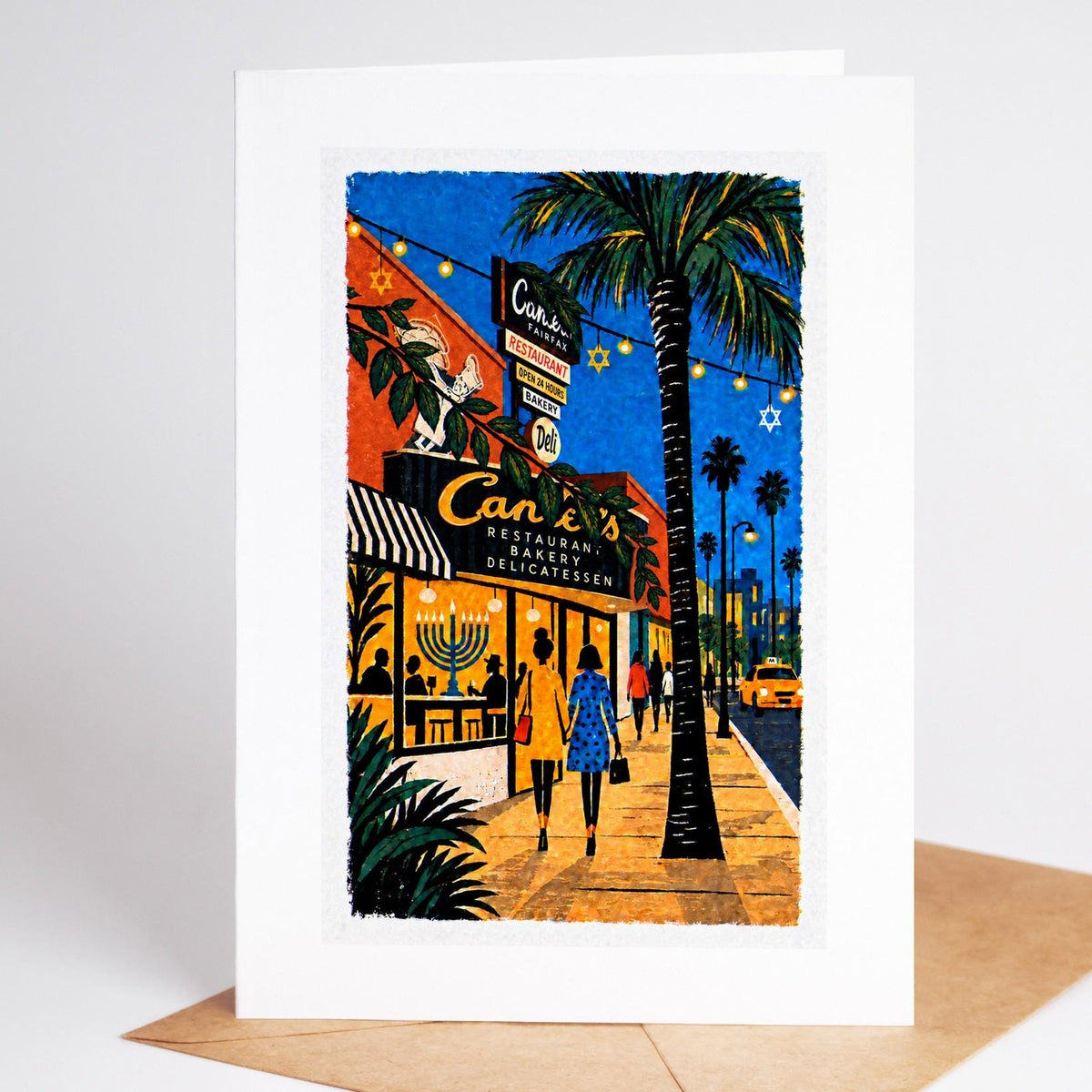 Los Angeles Hanukkah card standing with envelope, the Canter's deli sign on Fairfax with a menorah glowing inside
