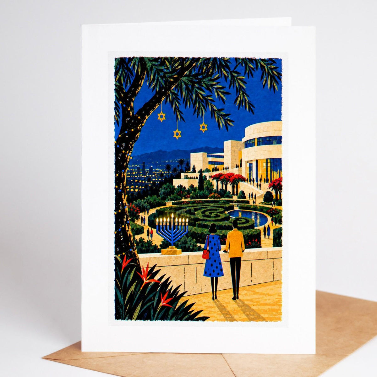 Los Angeles Hanukkah card standing with envelope, the Getty Center gardens above the city with a lit menorah on the terr