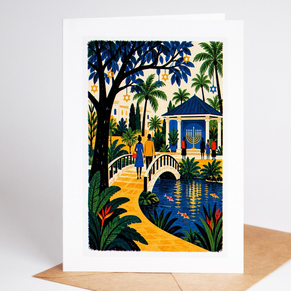 South Florida Hanukkah card standing with envelope, a botanical garden gazebo with a lit menorah above a koi pond