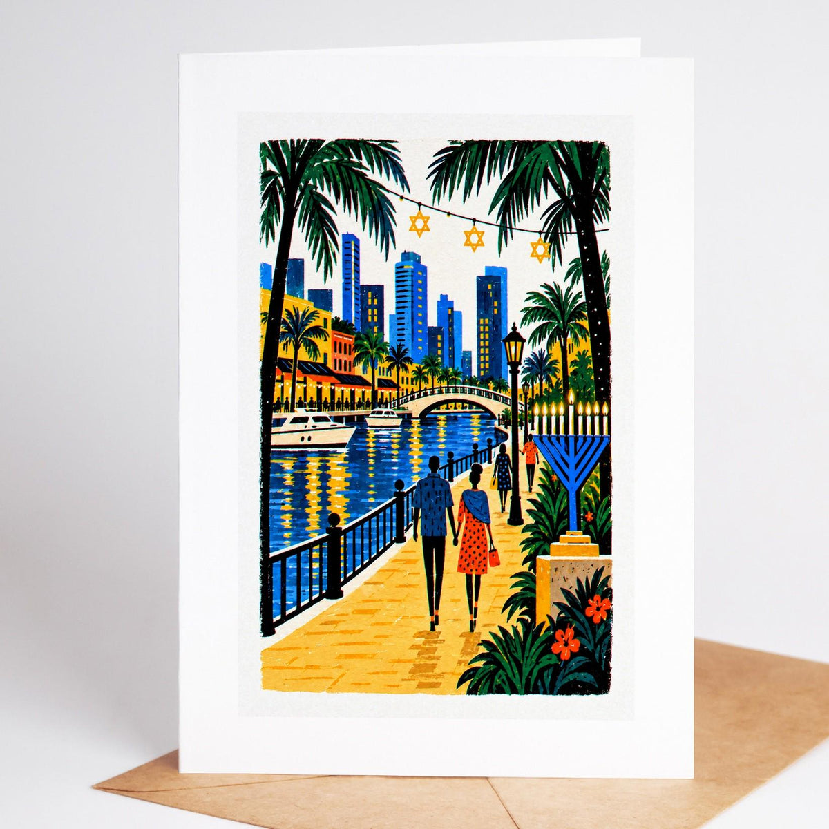 South Florida Hanukkah card standing upright, the Fort Lauderdale Riverwalk with a tall blue lit menorah by the water