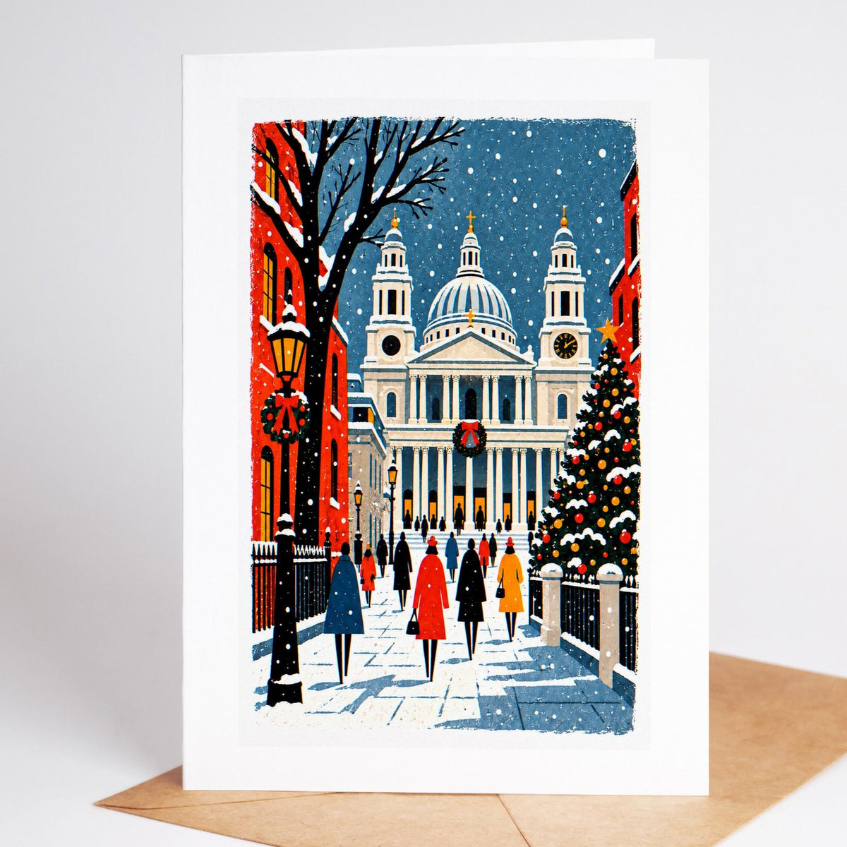London Christmas card standing with envelope, St Paul's Cathedral dome above snowy rooftops