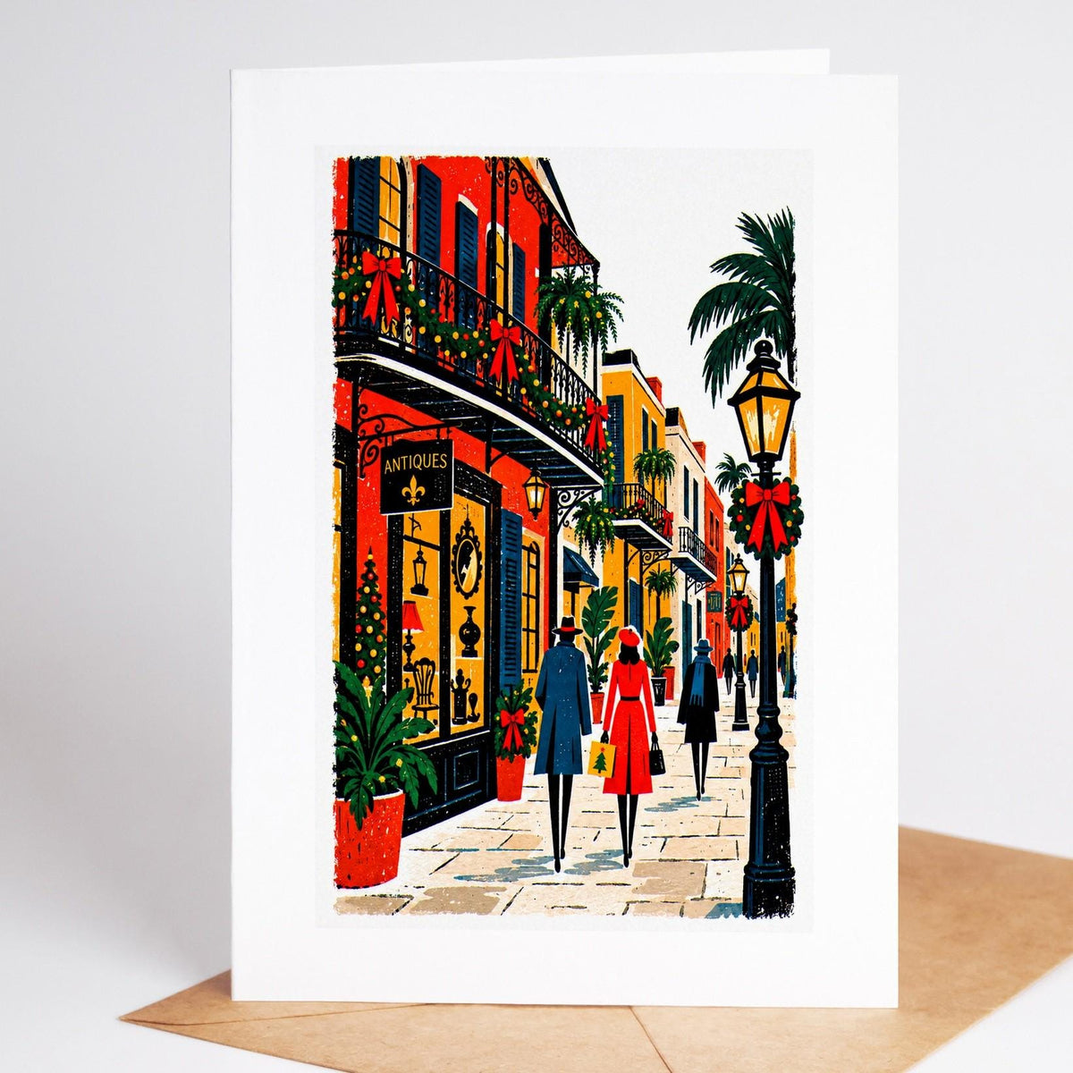 New Orleans Christmas card standing upright, Royal Street's balconies hung with garlands and red bows