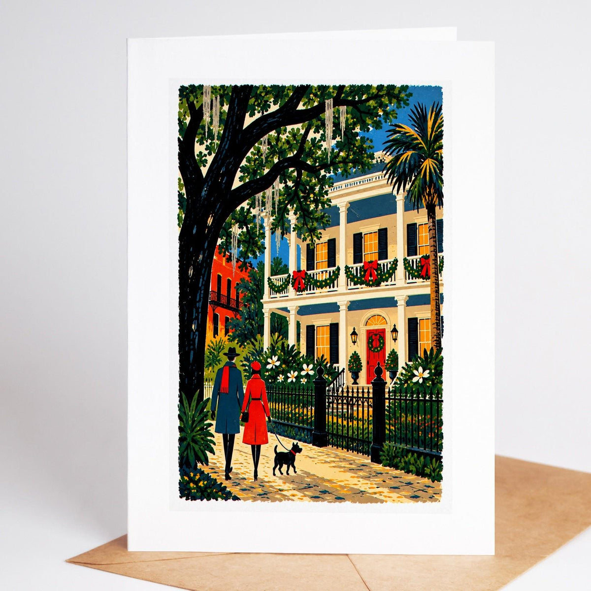 New Orleans Christmas card standing upright, a Garden District mansion behind its iron fence, decked in garlands