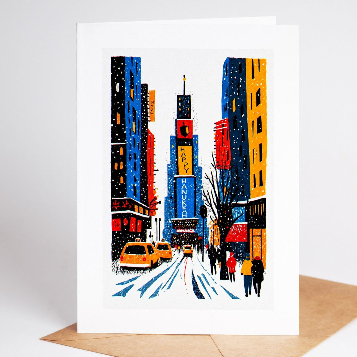 New York Hanukkah card standing with envelope, Times Square at night with a Happy Hanukkah billboard and a dreidel sign