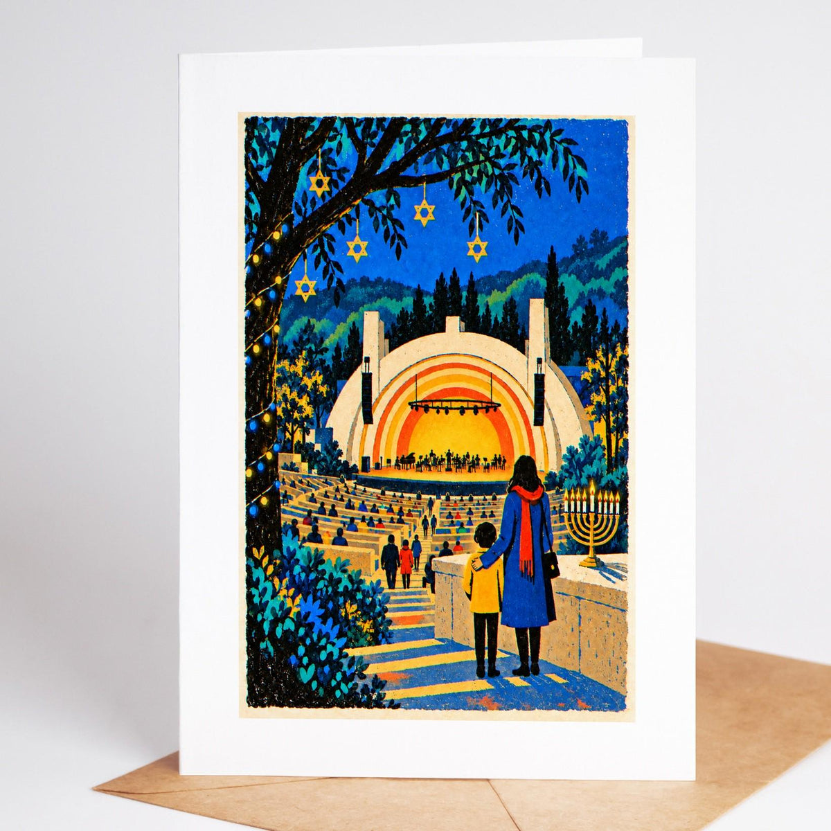Los Angeles Hanukkah card standing upright, the Hollywood Bowl shell at dusk with a lit menorah beside the seats