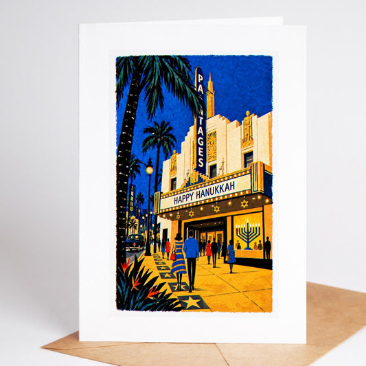 Los Angeles Hanukkah card standing upright, the Pantages Theatre marquee reading Happy Hanukkah