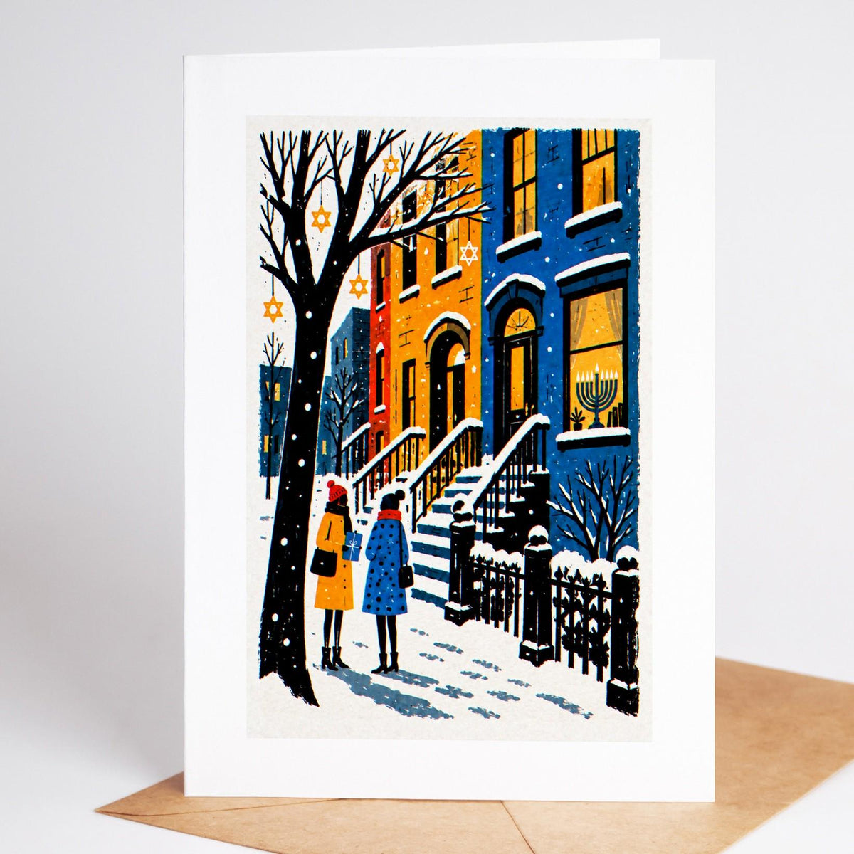 Brooklyn Hanukkah card standing with envelope, a Park Slope brownstone stoop in the snow with a menorah glowing in the w