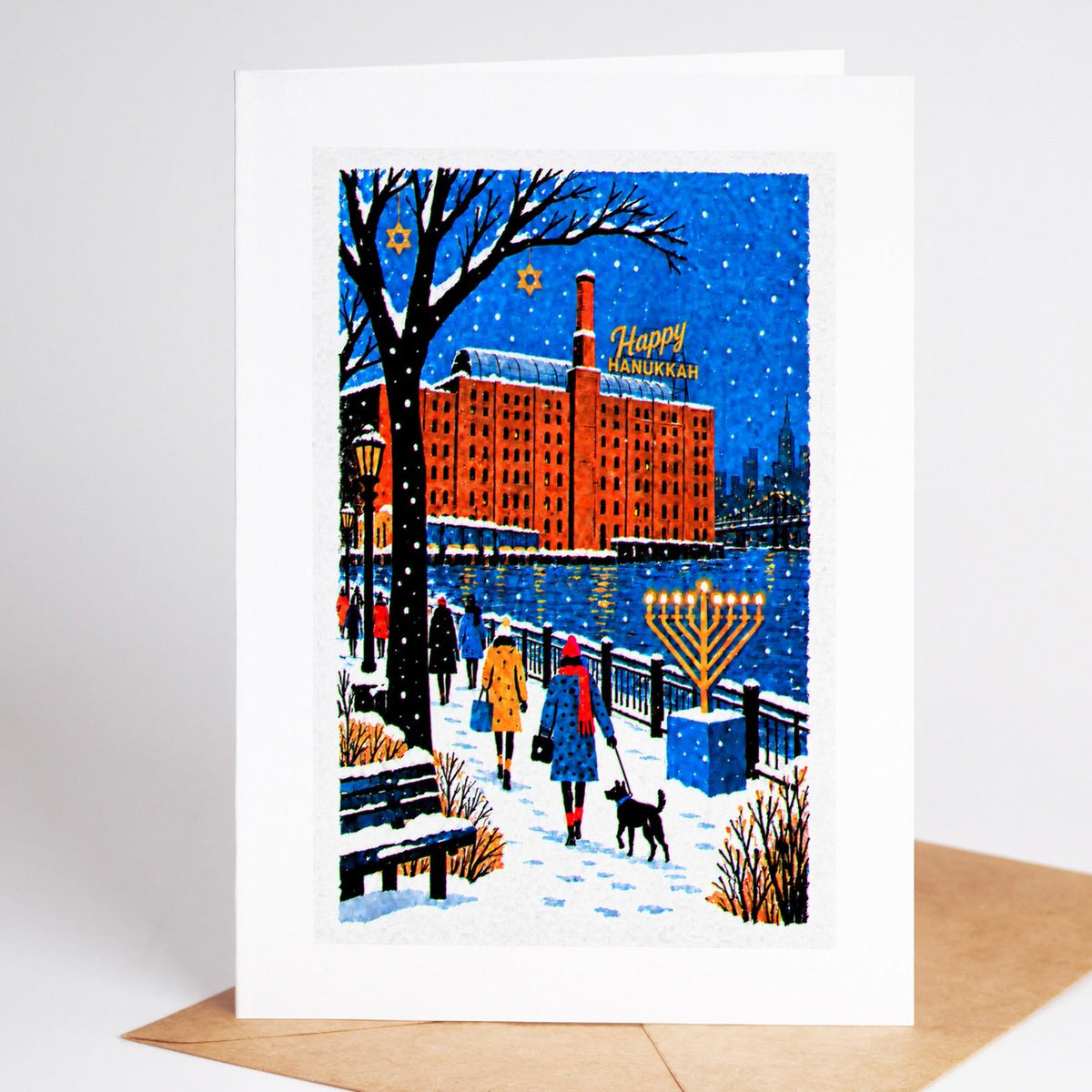 Brooklyn Hanukkah card standing with envelope, Domino Park by the old sugar refinery with a lit menorah on the waterfron