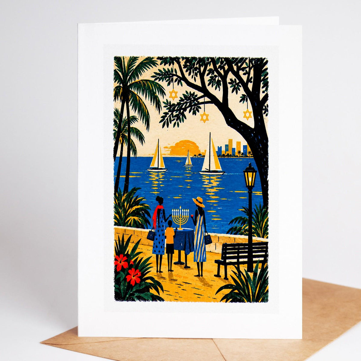 South Florida Hanukkah card standing upright, Coconut Grove sailboats at sunset with a family lighting a menorah