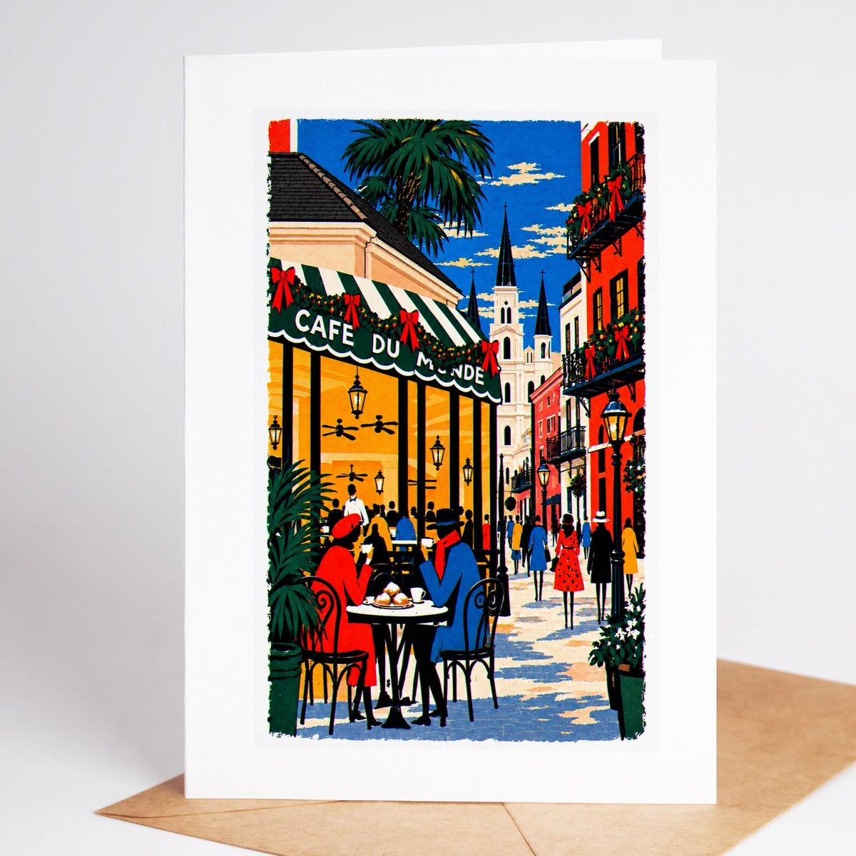 New Orleans Christmas card standing upright, the Cafe du Monde awning and its cafe tables at Christmas