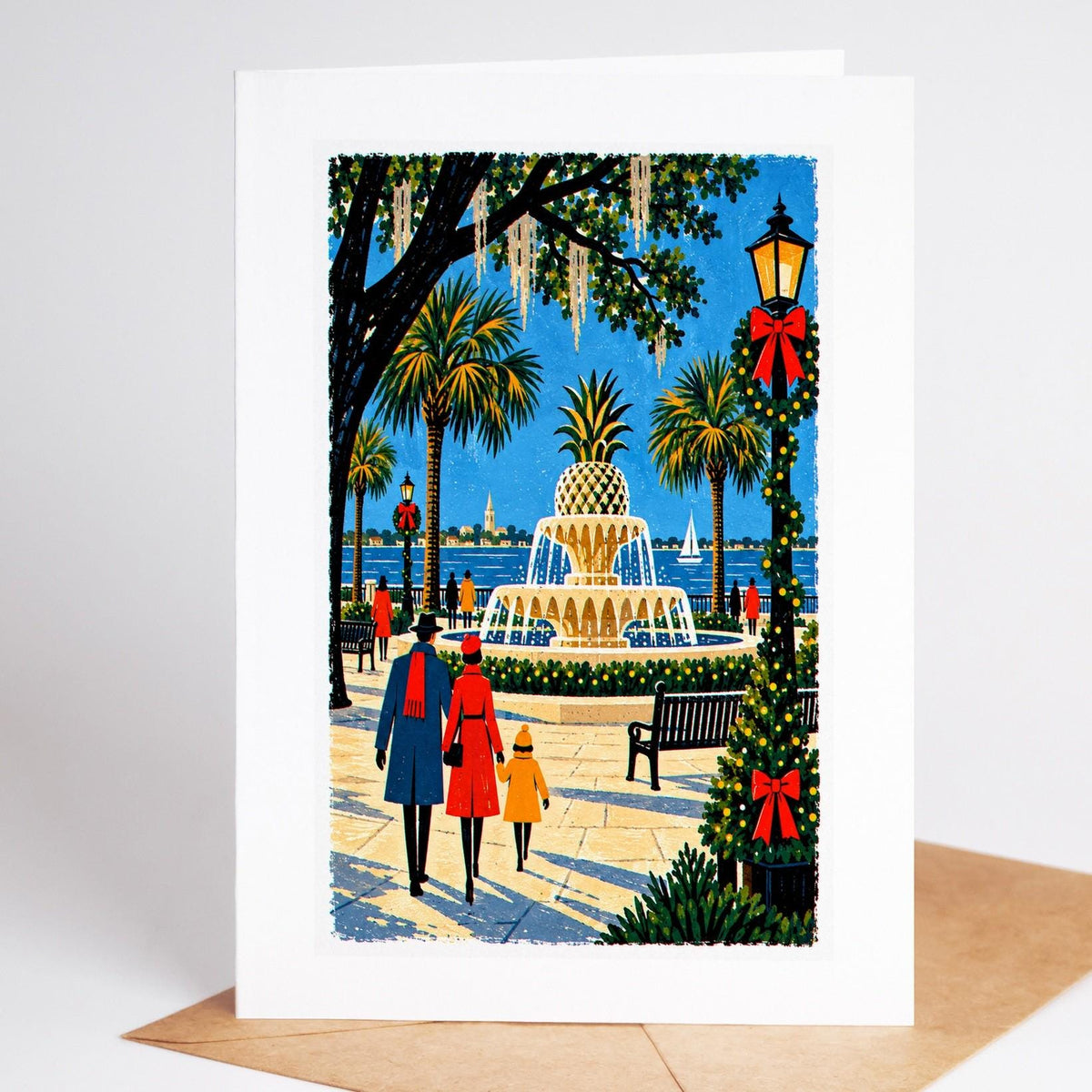 Charleston Christmas card standing upright, the Pineapple Fountain at Waterfront Park lit for the holidays