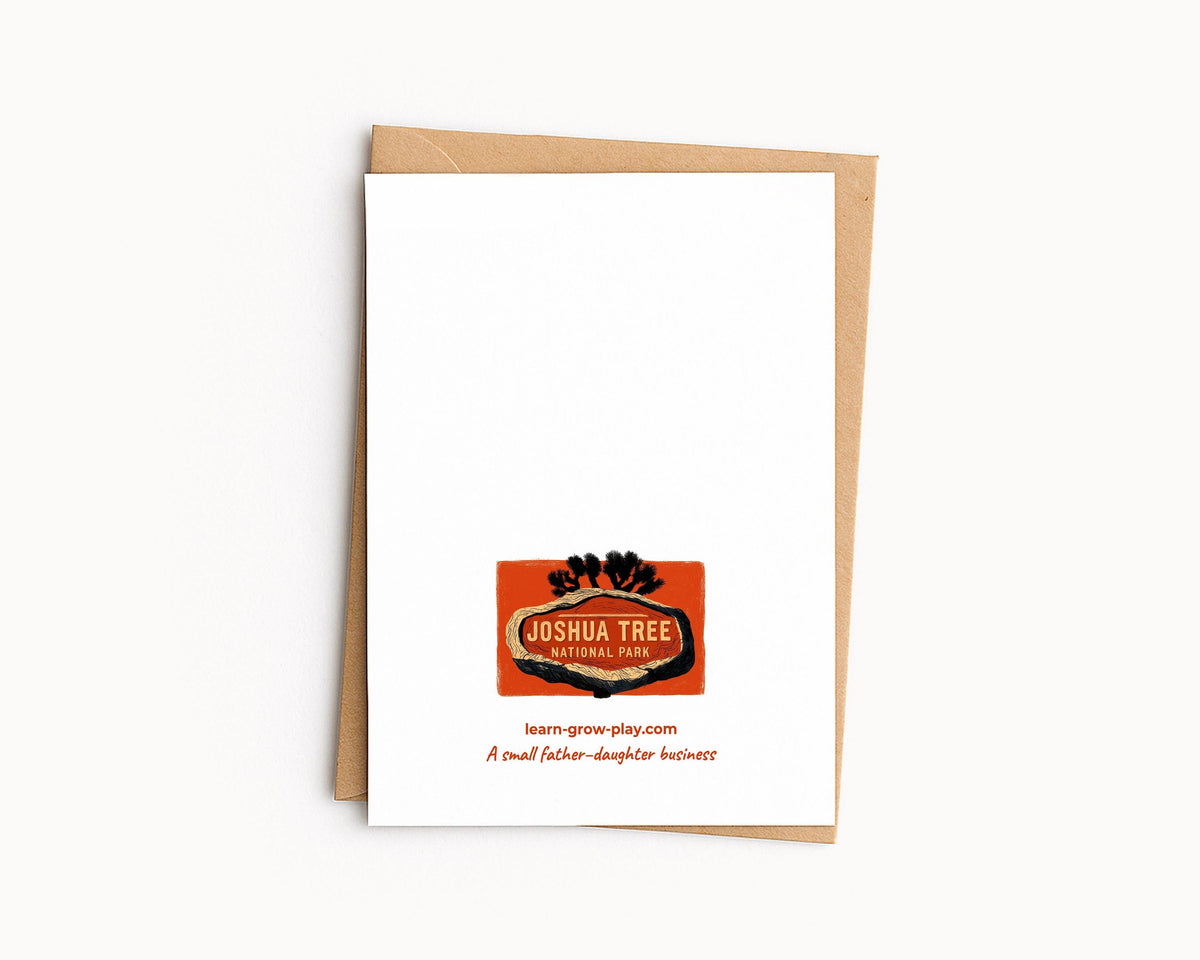 Back of a national park card on a kraft envelope, with the Joshua Tree park sign