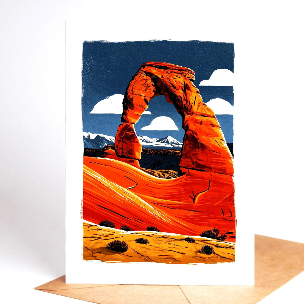 National park card, the red rock arch at Arches against a blue sky