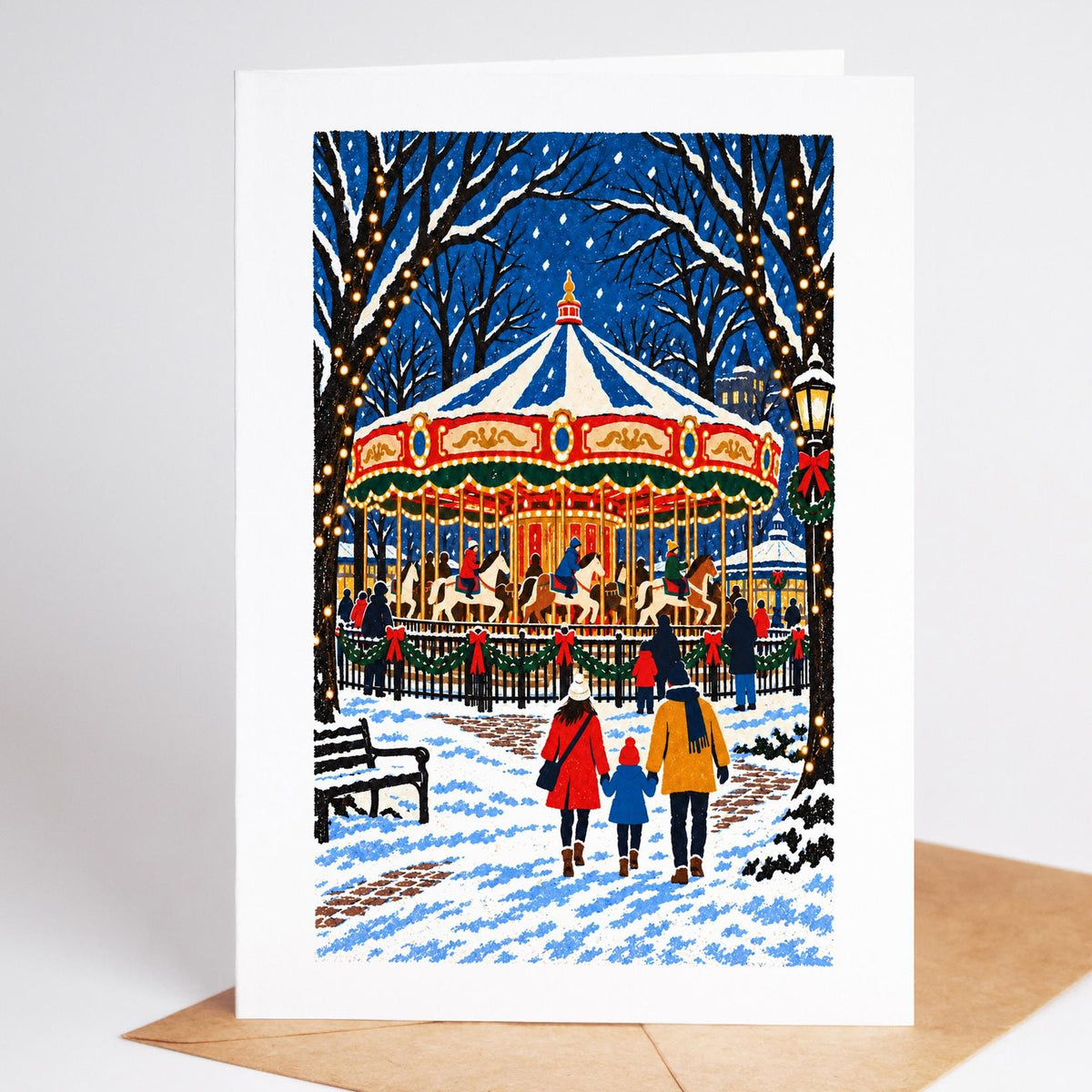 Philadelphia Christmas card standing upright, the Franklin Square carousel lit up under snowy trees